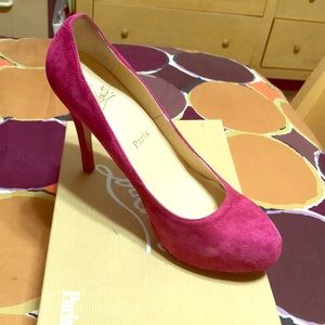Pink suede Christian Louboutin pumps